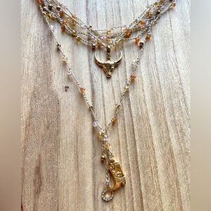 One thousand layers Gold & neutral Necklace with Bull & bootPendant. Hand made
